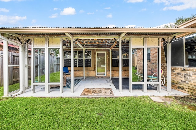 1343 Somercotes Ln, Channelview, TX 77530 - back of property with a patio area and metal roof