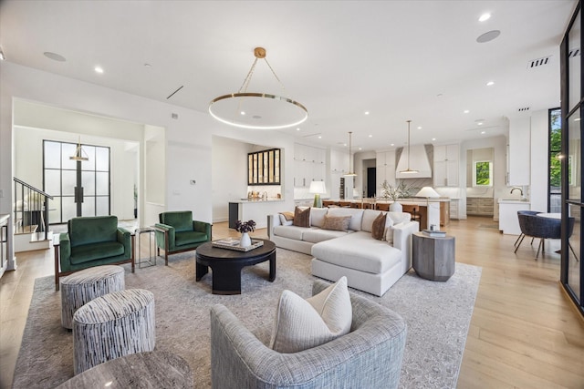 510 Wilmington Dr, Bellaire, TX 77401 - living area featuring stairs, light wood-type flooring, and recessed lighting