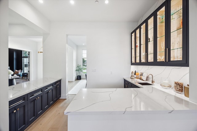 510 Wilmington Dr, Bellaire, TX 77401 - bar area featuring a sink, plenty of natural light, light wood finished floors, and recessed lighting