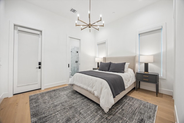 510 Wilmington Dr, Bellaire, TX 77401 - bedroom featuring a chandelier, light wood-style floors, and baseboards