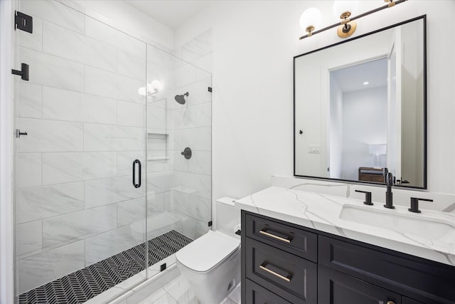 510 Wilmington Dr, Bellaire, TX 77401 - bathroom featuring toilet, a stall shower, and vanity
