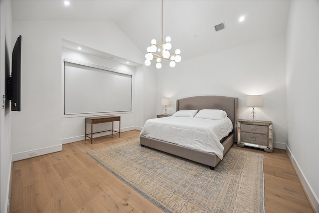 510 Wilmington Dr, Bellaire, TX 77401 - bedroom with wood-type flooring, lofted ceiling, baseboards, a chandelier, and recessed lighting