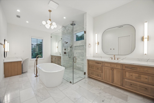 510 Wilmington Dr, Bellaire, TX 77401 - bathroom with a shower stall, vanity, marble look tiles, and recessed lighting