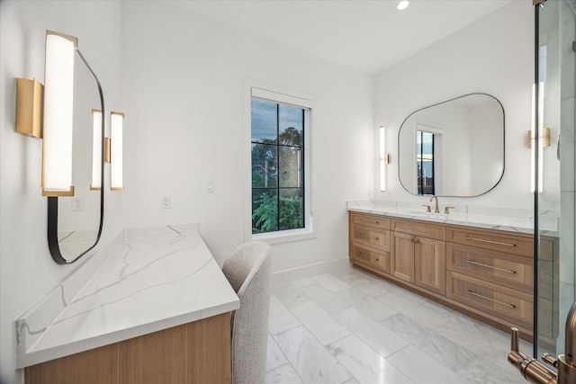 510 Wilmington Dr, Bellaire, TX 77401 - bathroom with marble look tile flooring, vanity, baseboards, and recessed lighting