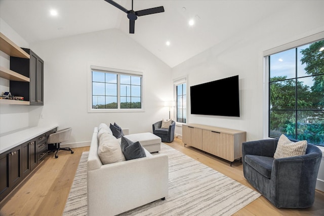 510 Wilmington Dr, Bellaire, TX 77401 - living room featuring a ceiling fan, plenty of natural light, light wood finished floors, recessed lighting, and high vaulted ceiling