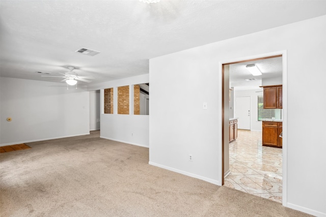 3811 Riverwood Park Dr, Houston, TX 77345 - unfurnished room with light carpet, a ceiling fan, and baseboards