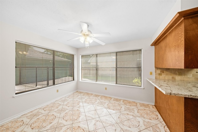 3811 Riverwood Park Dr, Houston, TX 77345 - unfurnished dining area with ceiling fan, baseboards, and light tile patterned flooring