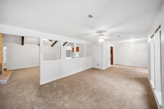 3811 Riverwood Park Dr, Houston, TX 77345 - carpeted spare room featuring a ceiling fan, baseboards, and a fireplace