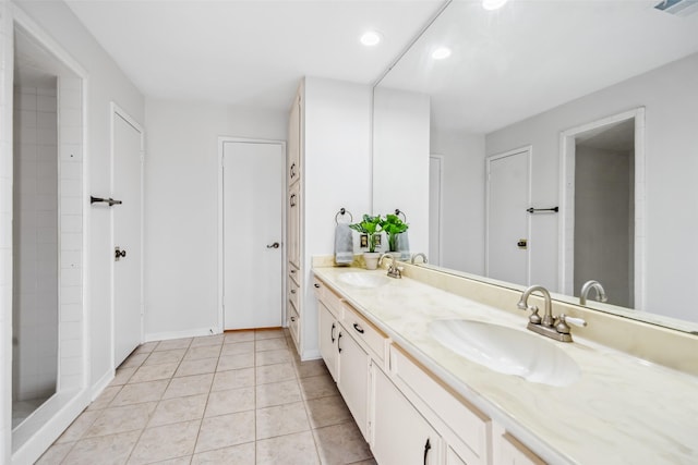 3811 Riverwood Park Dr, Houston, TX 77345 - full bath with double vanity, tile patterned flooring, recessed lighting, and baseboards