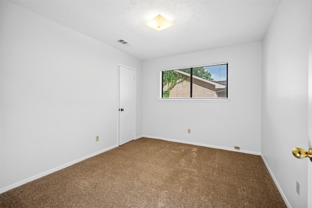 3811 Riverwood Park Dr, Houston, TX 77345 - carpeted spare room featuring baseboards and a textured ceiling