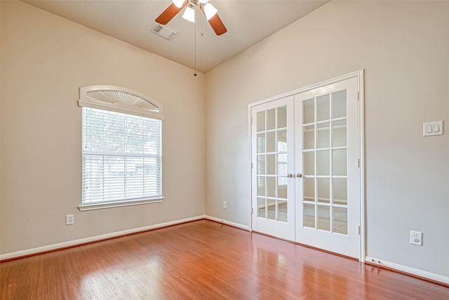 11519 Staffordale Ct, Cypress, TX 77433 - unfurnished room featuring french doors, wood finished floors, a ceiling fan, and baseboards