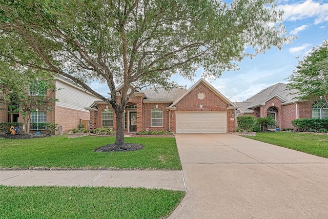 11519 Staffordale Ct, Cypress, TX 77433 - traditional-style house featuring an attached garage, concrete driveway, a front yard, and brick siding