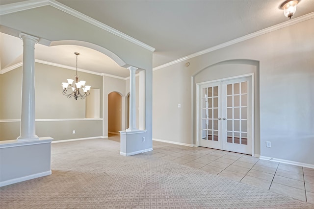 11519 Staffordale Ct, Cypress, TX 77433 - carpeted empty room featuring french doors, crown molding, baseboards, tile patterned flooring, and a chandelier