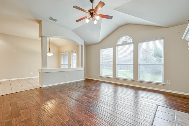 11519 Staffordale Ct, Cypress, TX 77433 - empty room featuring wood finished floors, ceiling fan, vaulted ceiling, plenty of natural light, and baseboards