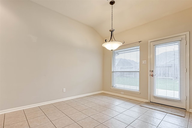 11519 Staffordale Ct, Cypress, TX 77433 - unfurnished dining area with light tile patterned floors, baseboards, and lofted ceiling
