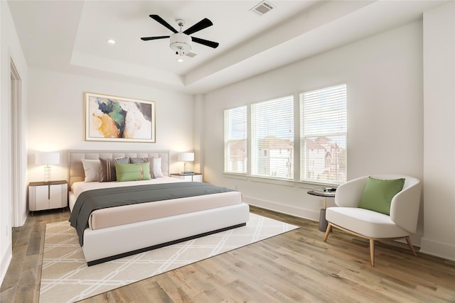 4407 Marina St Unit B, Houston, TX 77007 - bedroom featuring a raised ceiling, wood finished floors, baseboards, recessed lighting, and a ceiling fan