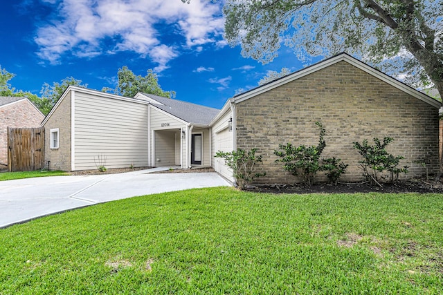 12014 Briar Forest Dr, Houston, TX 77077 - mid-century modern home with a garage, driveway, and brick siding