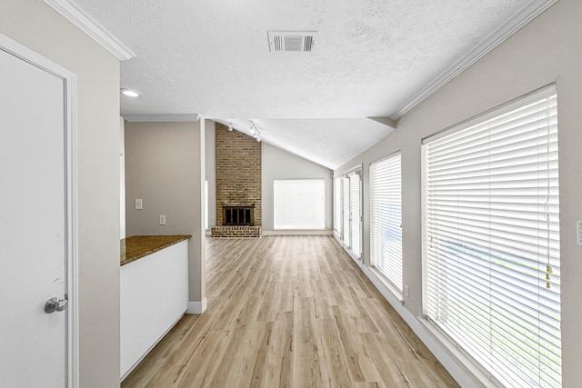12014 Briar Forest Dr, Houston, TX 77077 - corridor with a textured ceiling, light wood-type flooring, baseboards, and lofted ceiling