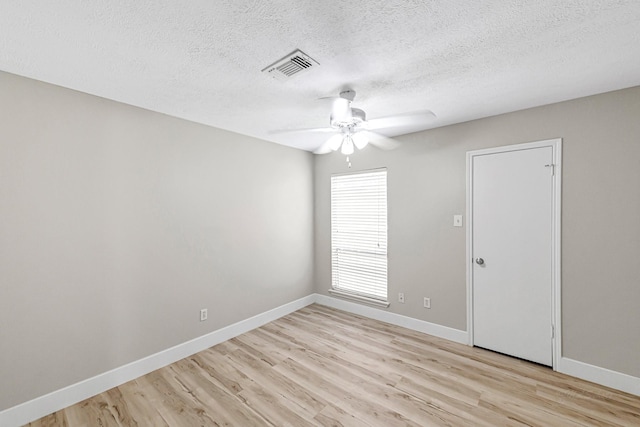 12014 Briar Forest Dr, Houston, TX 77077 - empty room featuring light wood finished floors, ceiling fan, a textured ceiling, and baseboards