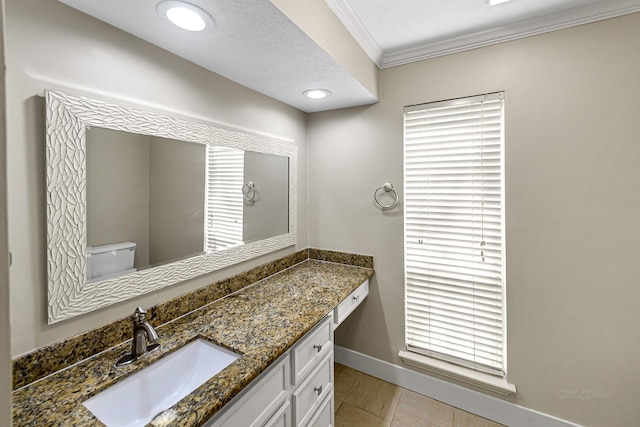 12014 Briar Forest Dr, Houston, TX 77077 - bathroom featuring toilet, ornamental molding, vanity, baseboards, and tile patterned flooring
