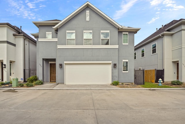 1920 Pueblo Nuevo Path, Houston, TX 77077 - townhome / multi-family property with stucco siding, concrete driveway, and an attached garage