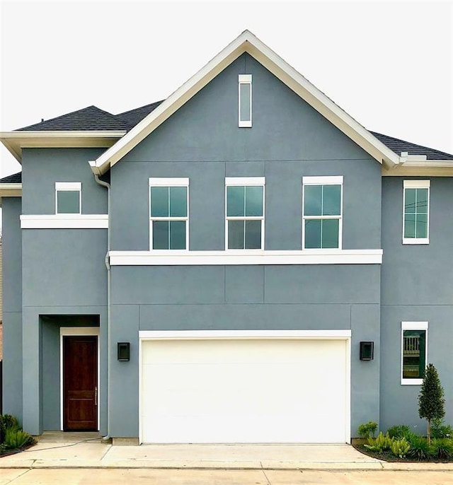 1920 Pueblo Nuevo Path, Houston, TX 77077 - view of front facade with stucco siding and a garage