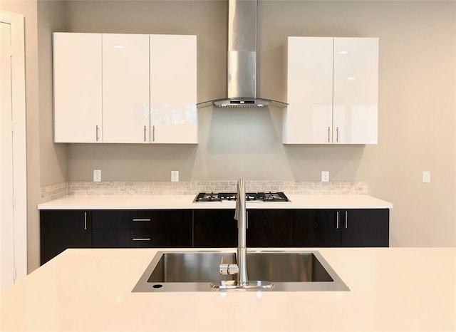 1920 Pueblo Nuevo Path, Houston, TX 77077 - kitchen featuring wall chimney exhaust hood, light countertops, white cabinets, and dark cabinets
