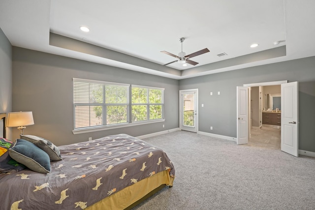 1920 Pueblo Nuevo Path, Houston, TX 77077 - bedroom featuring a tray ceiling, baseboards, carpet, recessed lighting, and connected bathroom