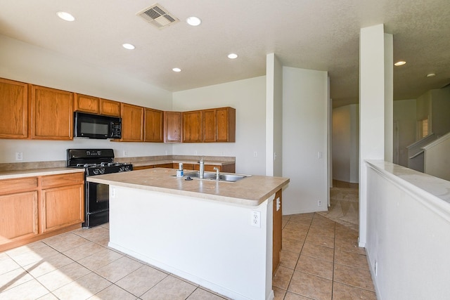 3043 Feather Green Trl, Fresno, TX 77545 - kitchen with black appliances, a sink, light tile patterned flooring, recessed lighting, and brown cabinetry