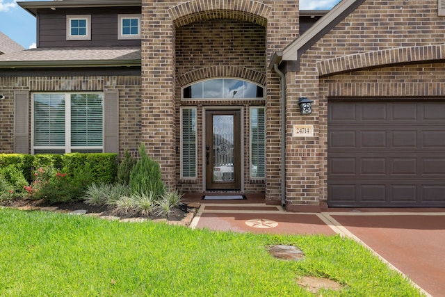 24714 Longwood Forest Dr, Spring, TX 77373 - property entrance with brick siding and a garage