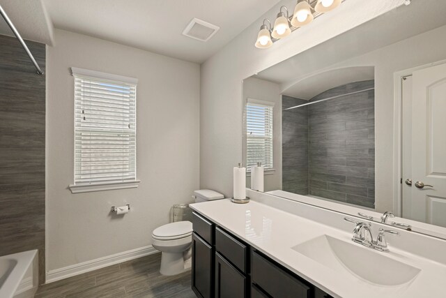 24714 Longwood Forest Dr, Spring, TX 77373 - full bathroom with toilet, plenty of natural light, vanity, and baseboards