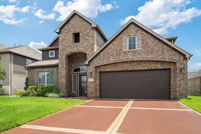 24714 Longwood Forest Dr, Spring, TX 77373 - french country home featuring brick siding, driveway, and a front lawn