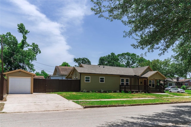 4801 Walker St, Houston, TX 77023 - view of front of property featuring driveway, a detached garage, and a porch