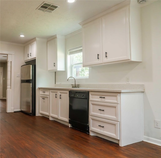 4801 Walker St, Houston, TX 77023 - kitchen featuring dishwasher, freestanding refrigerator, dark wood-type flooring, light countertops, and crown molding