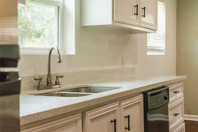 4801 Walker St, Houston, TX 77023 - kitchen with a sink, dishwasher, plenty of natural light, and light countertops