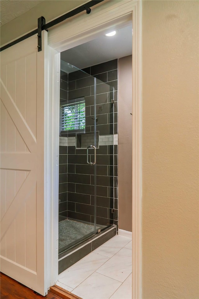 4801 Walker St, Houston, TX 77023 - bathroom featuring a stall shower and tile patterned flooring