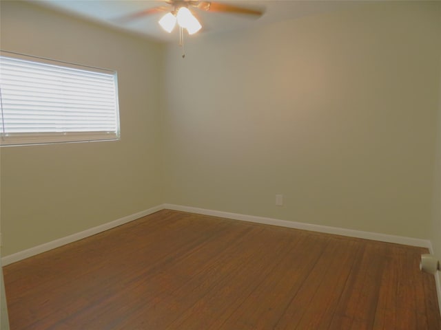 4801 Walker St, Houston, TX 77023 - empty room with wood finished floors, a ceiling fan, and baseboards