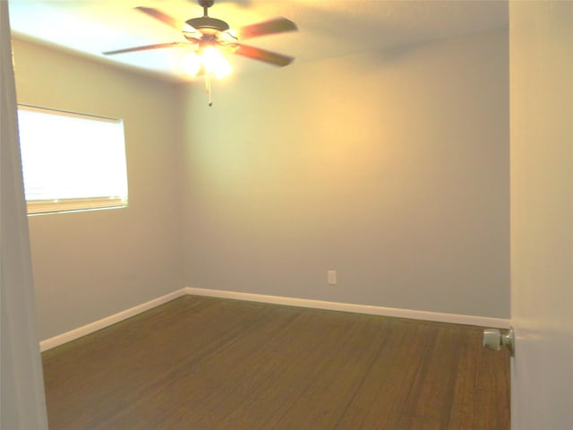 4801 Walker St, Houston, TX 77023 - unfurnished room with dark wood finished floors, ceiling fan, and baseboards