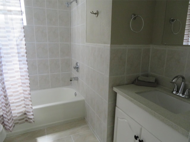 4801 Walker St, Houston, TX 77023 - bathroom with tile walls, shower / tub combo with curtain, vanity, and tile patterned floors