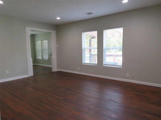 4801 Walker St, Houston, TX 77023 - spare room with dark wood finished floors, recessed lighting, and baseboards