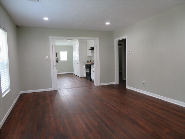 4801 Walker St, Houston, TX 77023 - unfurnished room with dark wood finished floors, baseboards, and recessed lighting