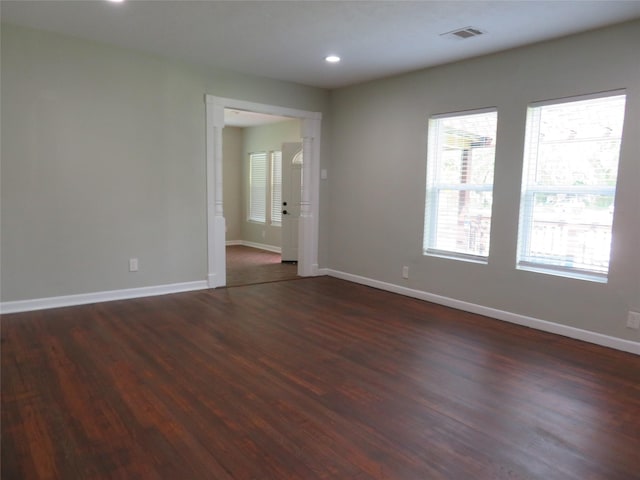 4801 Walker St, Houston, TX 77023 - unfurnished room with dark wood finished floors, baseboards, and recessed lighting