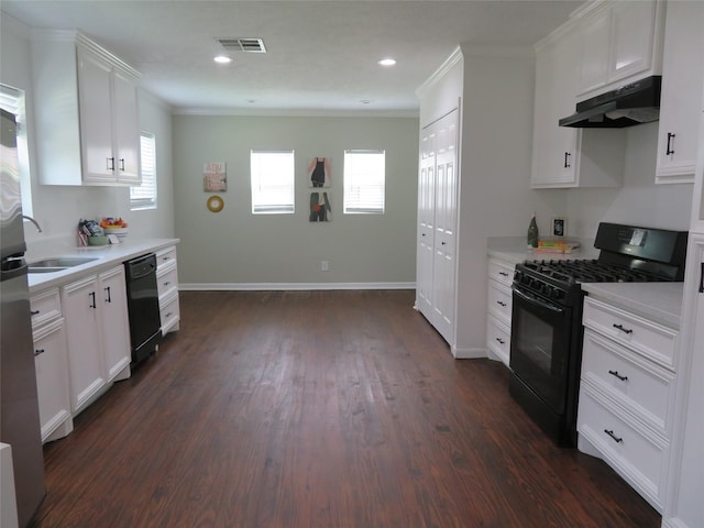 4801 Walker St, Houston, TX 77023 - kitchen featuring under cabinet range hood, black appliances, a sink, light countertops, and ornamental molding