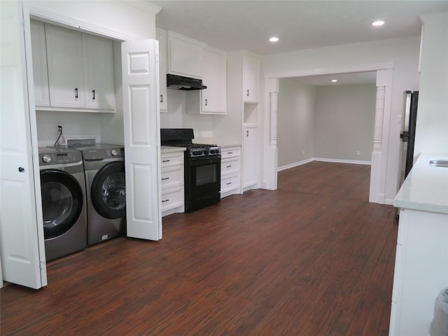 4801 Walker St, Houston, TX 77023 - washroom with cabinet space, washer and clothes dryer, dark wood-style floors, recessed lighting, and baseboards