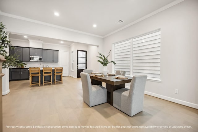 833 Fisher St Unit C, Houston, TX 77018 - dining area with recessed lighting, crown molding, light wood-style flooring, and baseboards