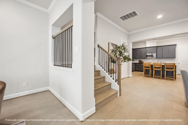 833 Fisher St Unit C, Houston, TX 77018 - stairs featuring ornamental molding, wood finished floors, baseboards, and recessed lighting