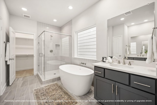 833 Fisher St Unit C, Houston, TX 77018 - bathroom with a stall shower, vanity, a freestanding bath, healthy amount of natural light, and recessed lighting