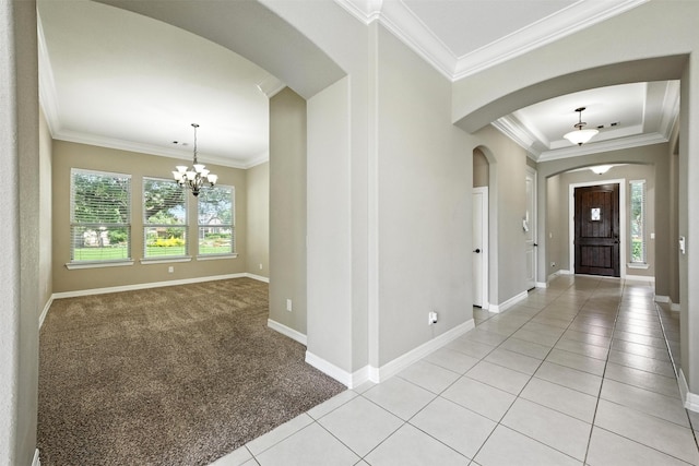 4914 Fairford Dr, Sugar Land, TX 77479 - entryway featuring arched walkways, a chandelier, ornamental molding, light tile patterned floors, and light colored carpet