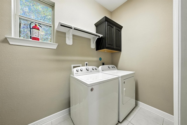 4914 Fairford Dr, Sugar Land, TX 77479 - laundry room featuring washing machine and clothes dryer, cabinet space, and light tile patterned floors