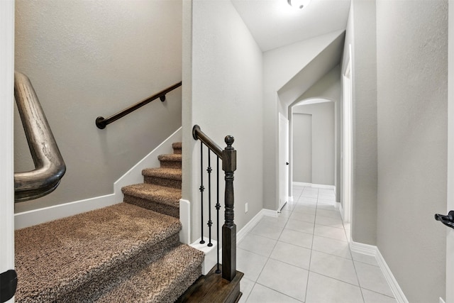 4914 Fairford Dr, Sugar Land, TX 77479 - stairway featuring tile patterned floors and arched walkways